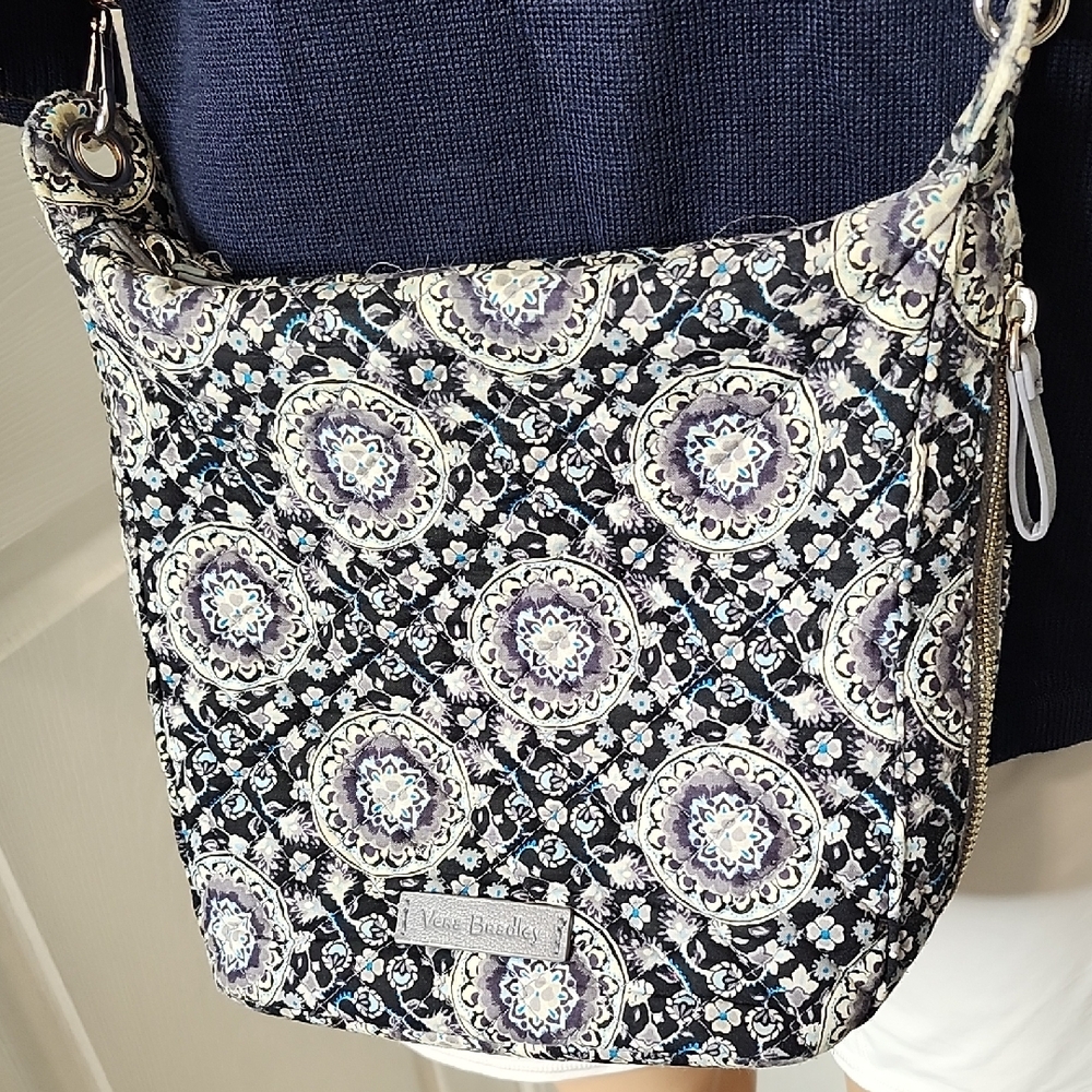 Vera Bradley Navy Blue and White Floral Crossbody Bag With Zip Closure.